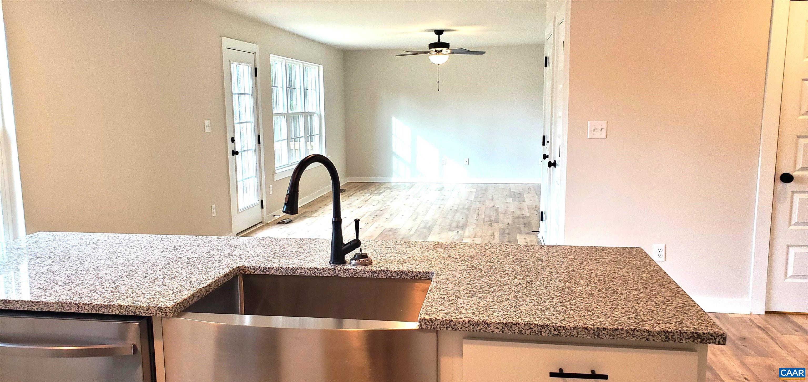 4245 Roundabout Road Louisa, VA 23093 - Photo 12 of 36 a kitchen with granite countertop a sink and a granite top
