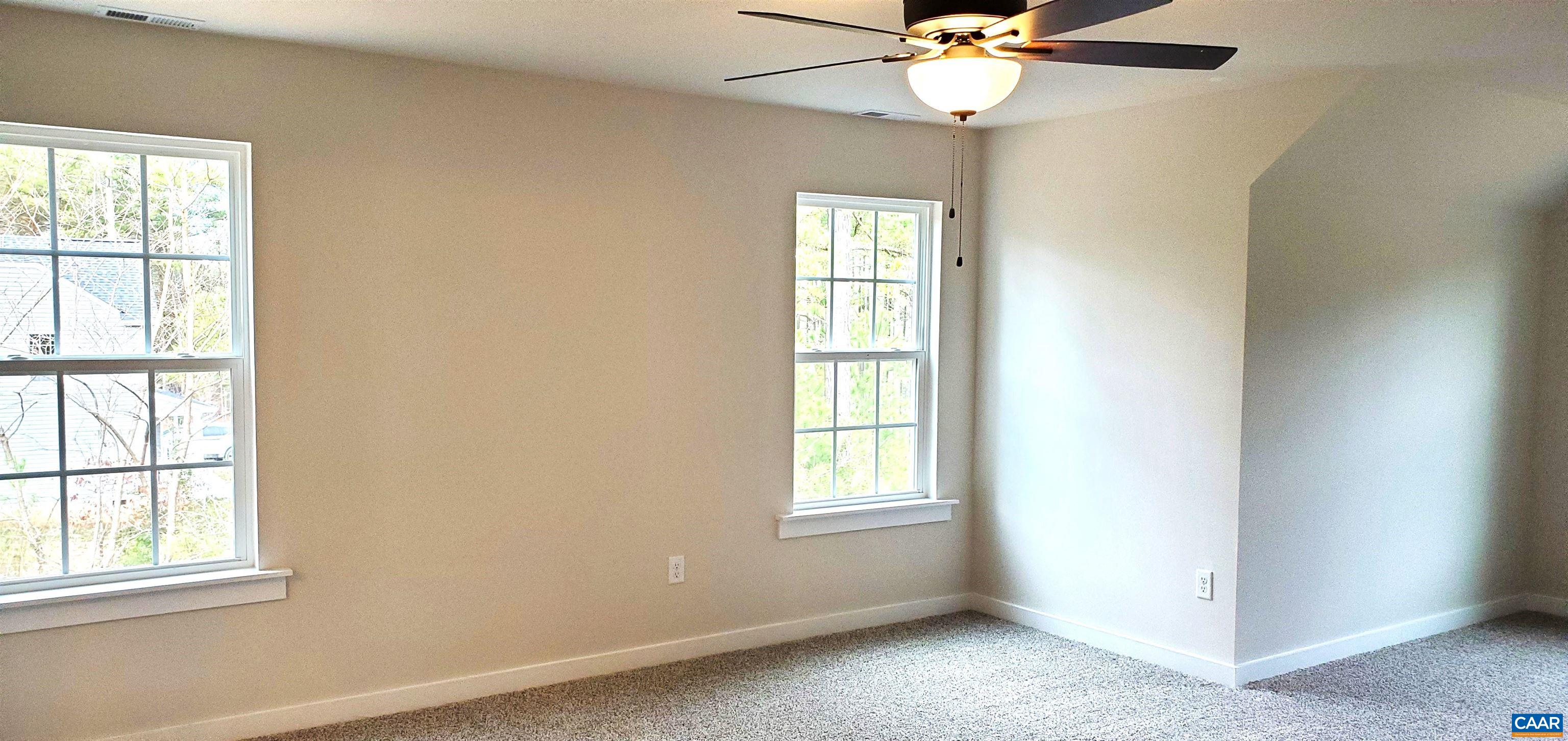 4245 Roundabout Road Louisa, VA 23093 - Photo 21 of 36 an empty room with windows and fan