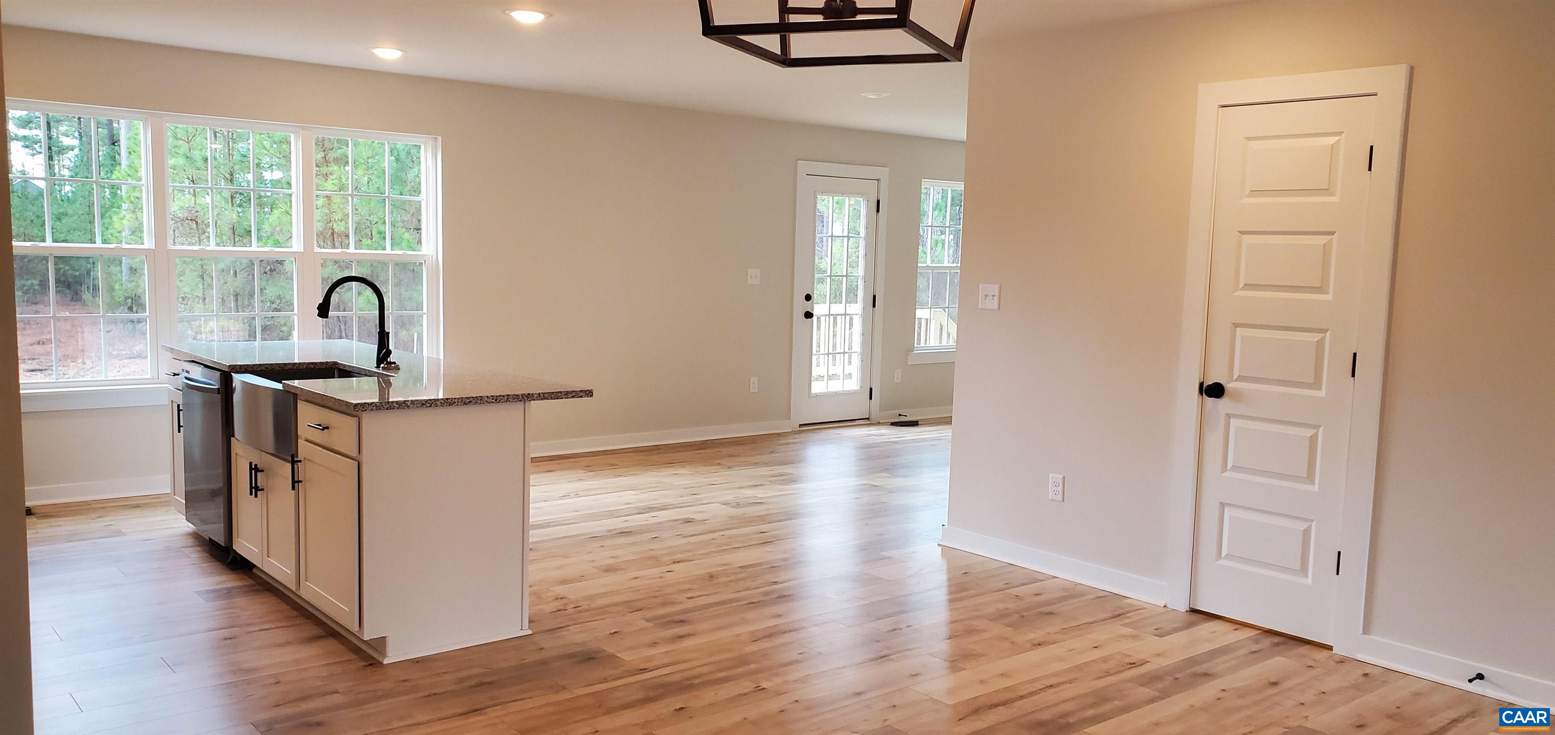 4245 Roundabout Road Louisa, VA 23093 - Photo 6 of 36 a view of a kitchen cabinets a sink and wooden floor