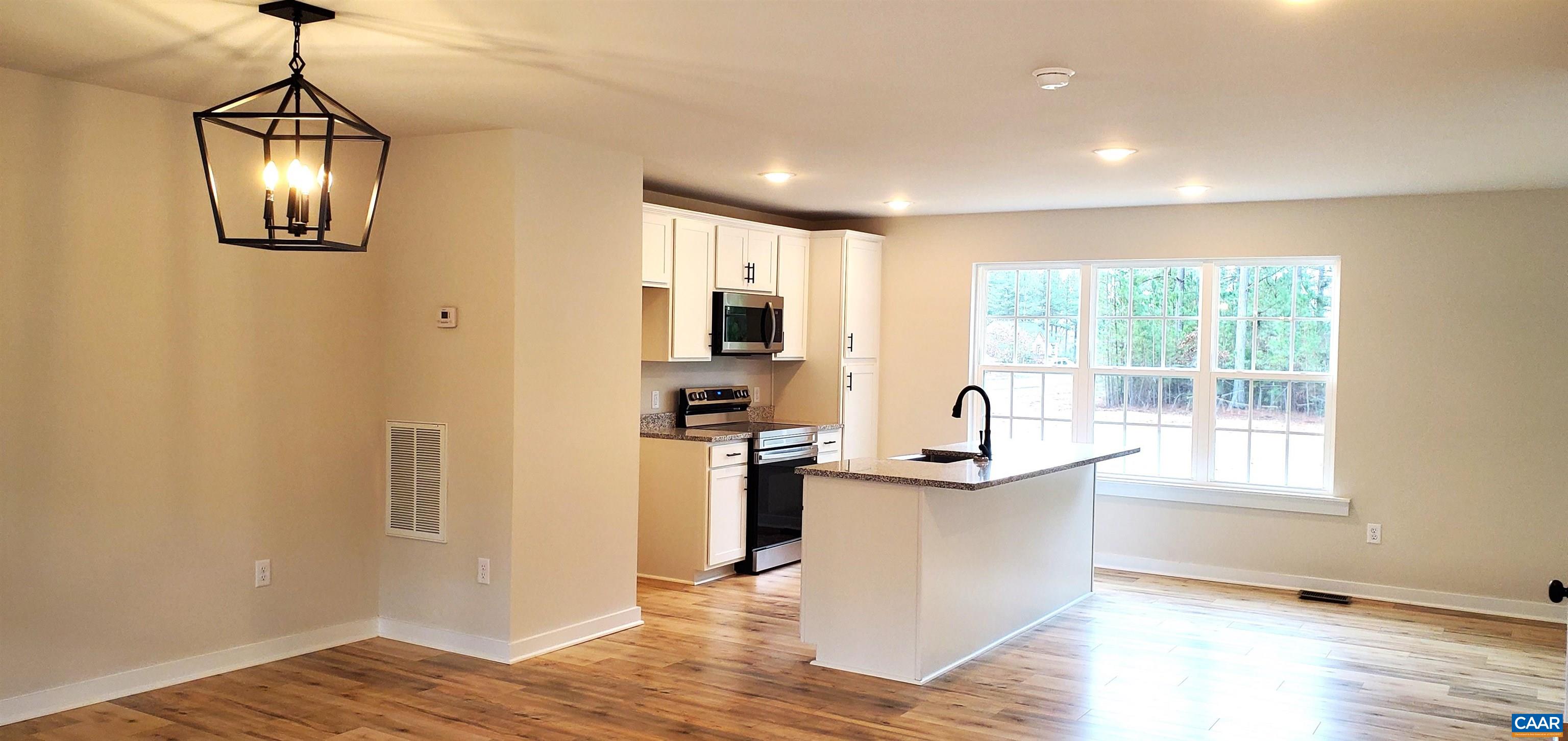 4245 Roundabout Road Louisa, VA 23093 - Photo 9 of 36 a view of kitchen with stainless steel appliances granite countertop cabinets and wooden floor