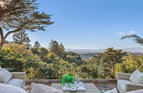 a view of a chairs and table in the patio