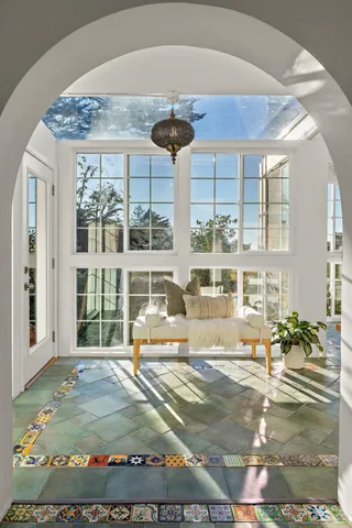 a view of a dry yard with mountains in the background