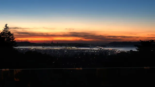 a bed sitting in a bathroom next to a window
