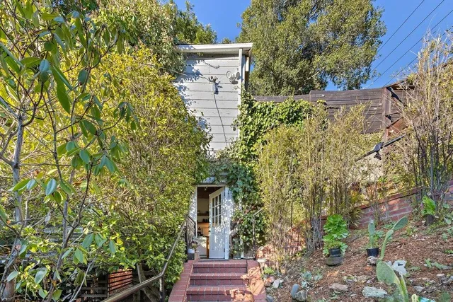 a backyard of a house with lots of green space