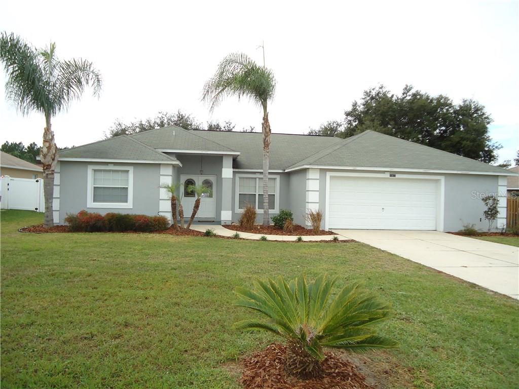 10827 Crescent Ridge Loop Clermont, FL 34711 - Photo 1 of 1 Front elevation with large front yard