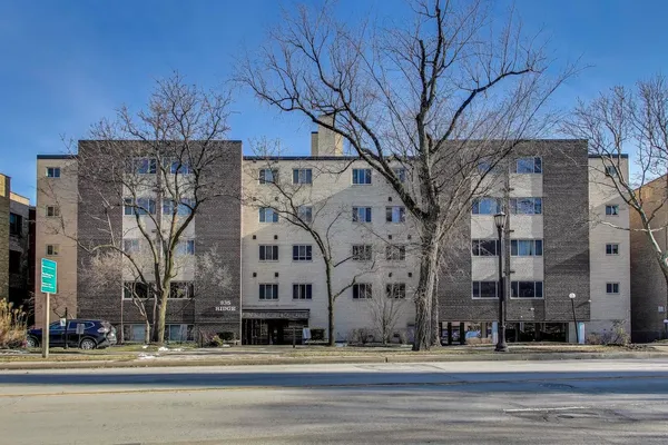 a view of a building with a street