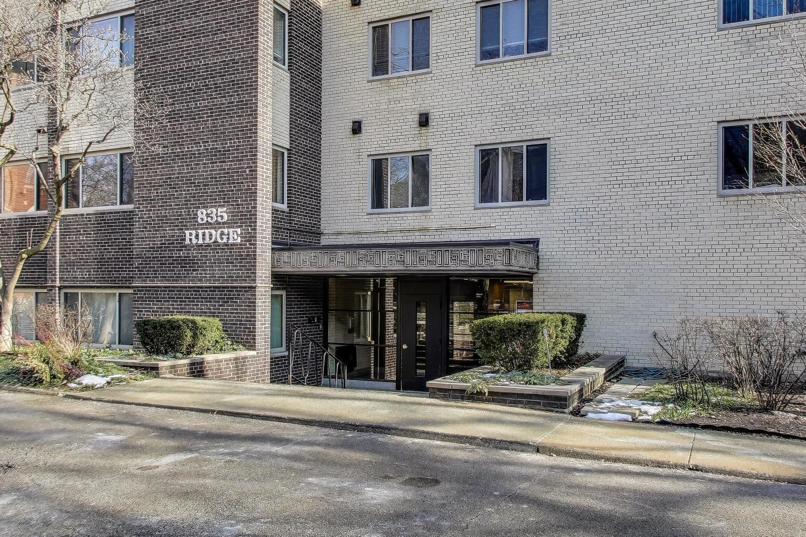 835 Ridge Avenue, Unit 205 Evanston, IL 60202 - Photo 2 of 18 a view of a building with a bench in front of building