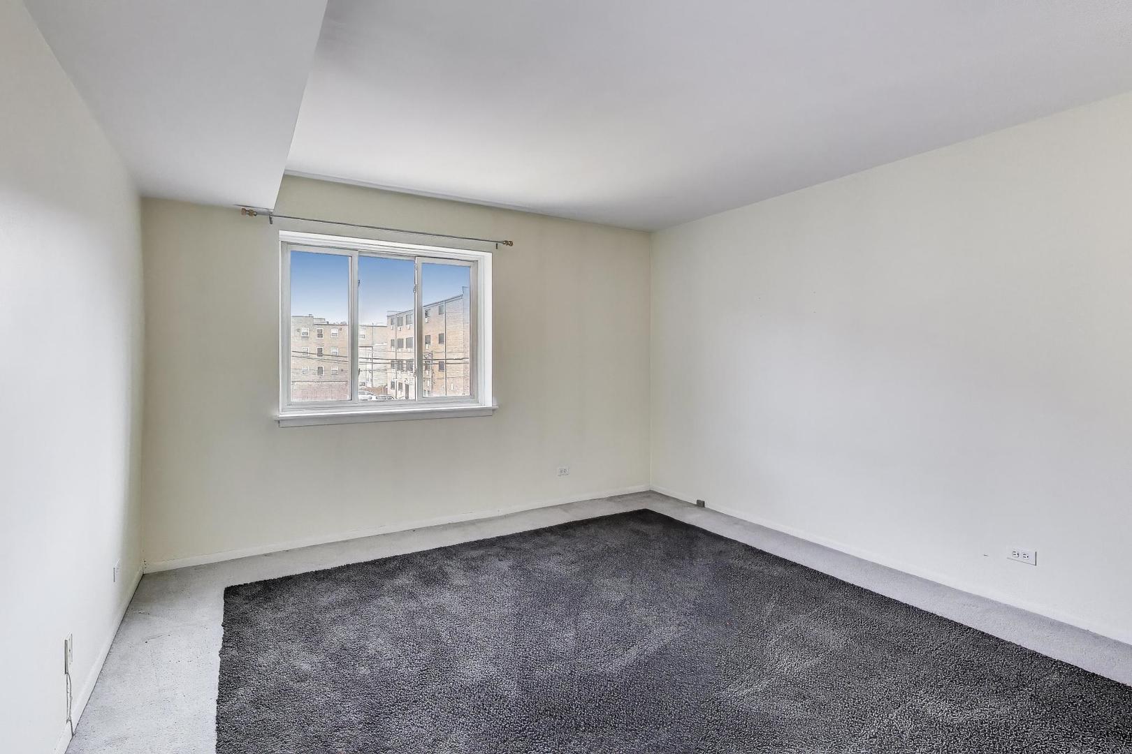 835 Ridge Avenue, Unit 205 Evanston, IL 60202 - Photo 9 of 18 an empty room with a window