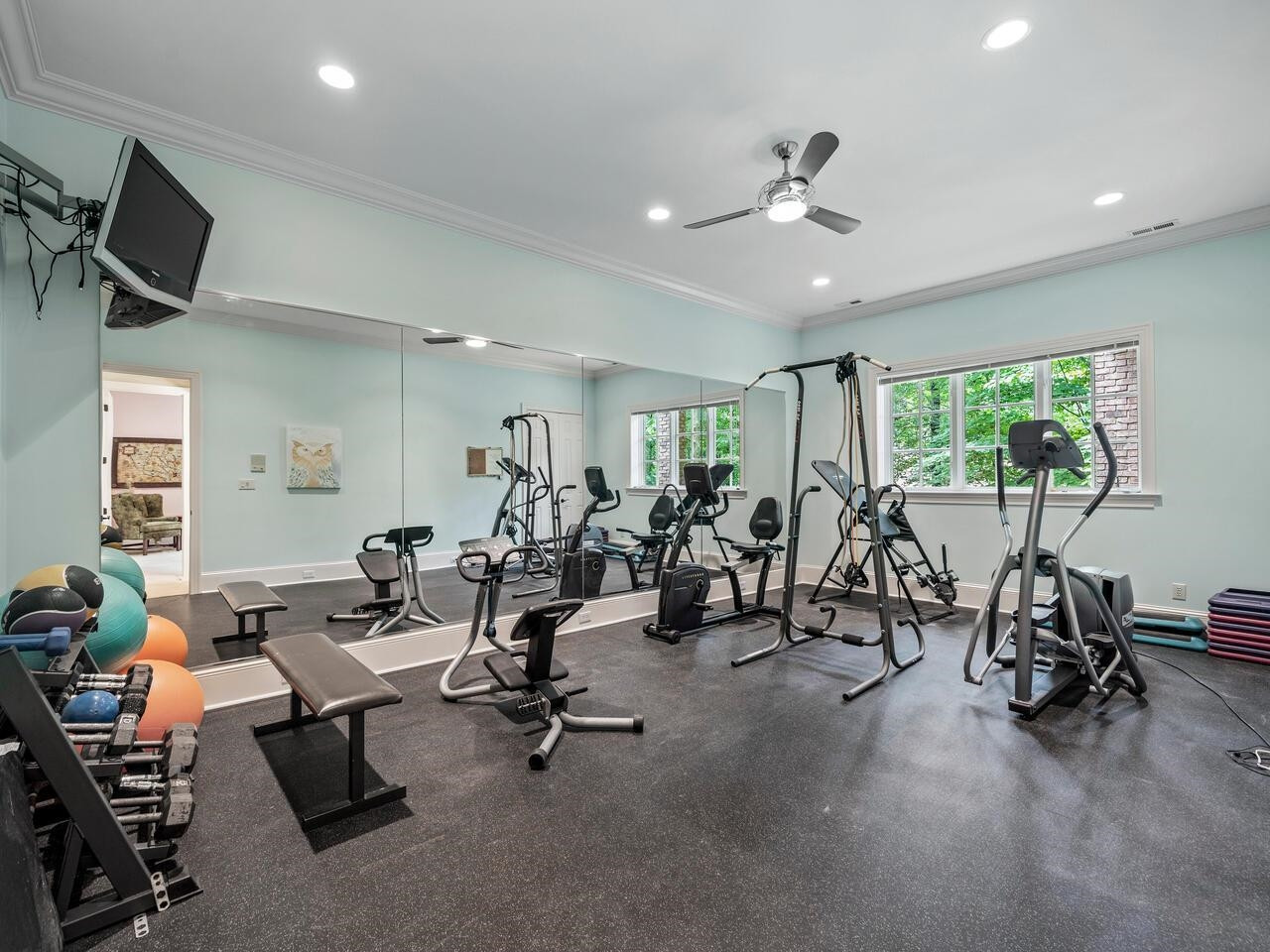 11216 Jonas Ridge Lane Raleigh, NC 27613 - Photo 56 of 75 With rubber flooring and full wall mirror Gym