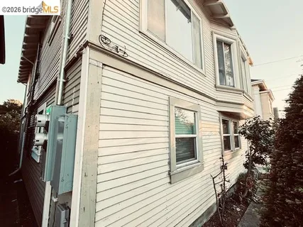a view of a house with a door and wooden floor