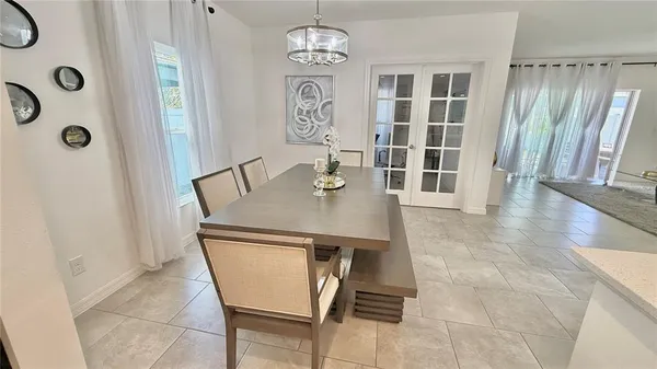 a view of a dining room with furniture and window