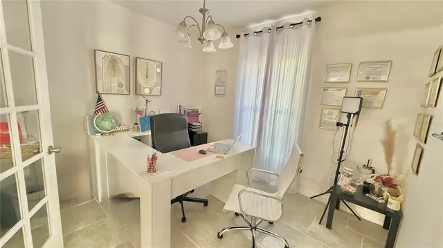 a very nice looking dining room with a table and chairs