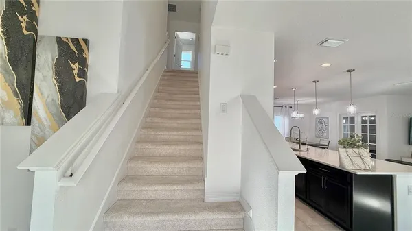 a view of a hallway with seating space