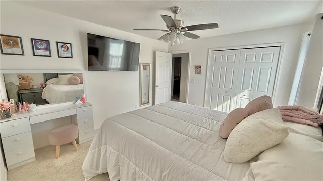 a bedroom with a large bed and a window