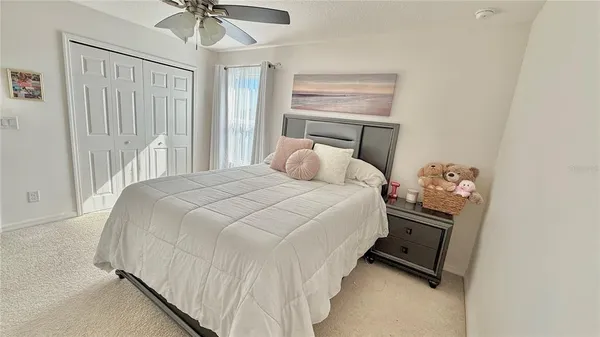 a bedroom with a bed and window