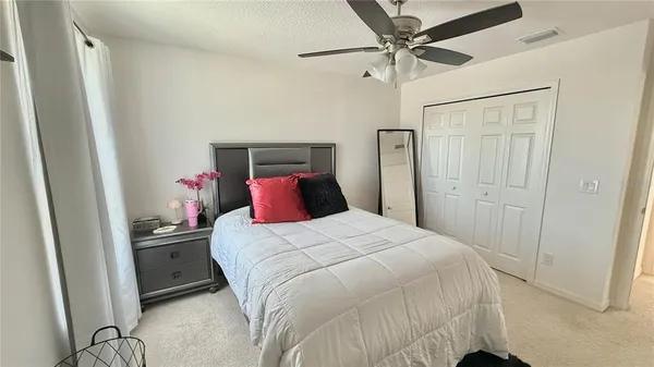 a bedroom with a bed and a table