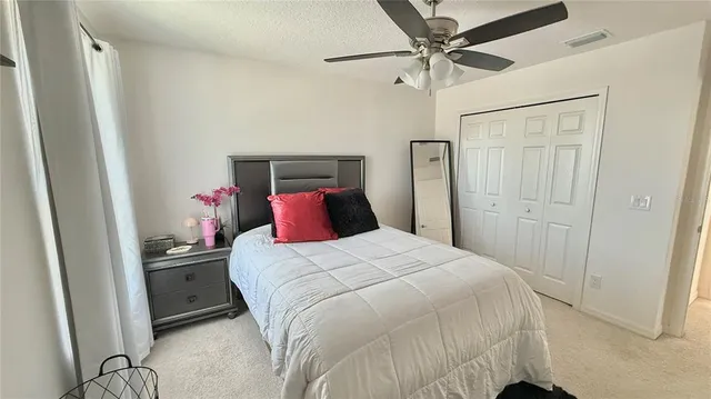 a bedroom with a bed and a table