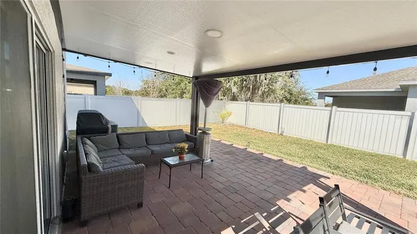 a bedroom with furniture and natural light