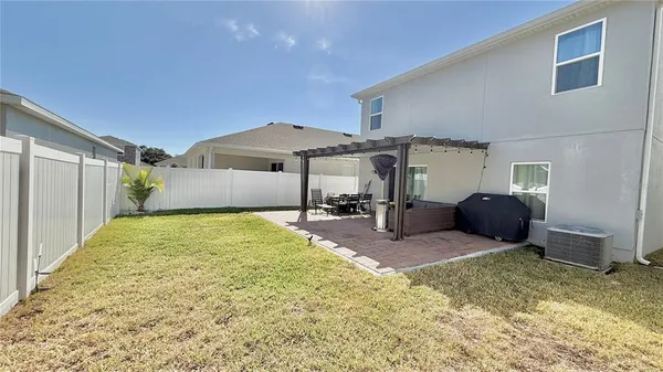 a house view with a backyard space