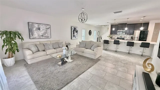 a living room with furniture and a view of living room