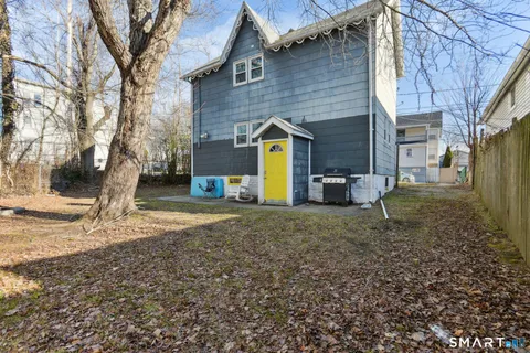 a picture of a bench in front of a wall