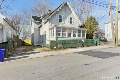a view of a house with a street