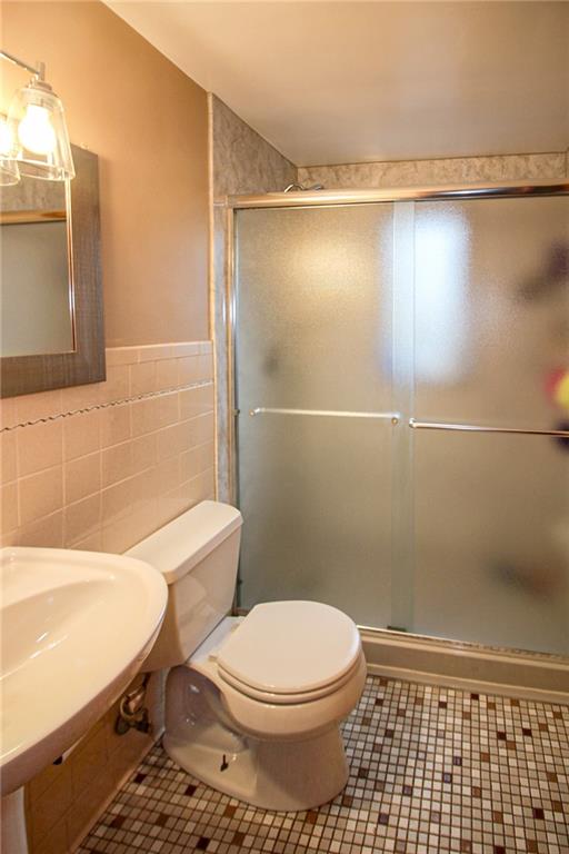164 Gill Hall Road Clairton, PA 15025 - Photo 14 of 30 a bathroom with a toilet a sink and shower
