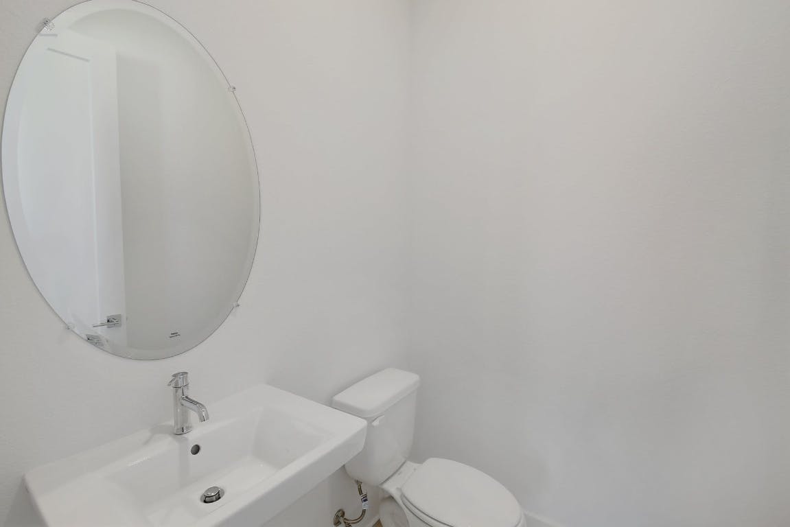 2050 Lohmans Spur Road, Unit 402 Austin, TX 78734 - Photo 17 of 39 a bathroom with a sink and a mirror