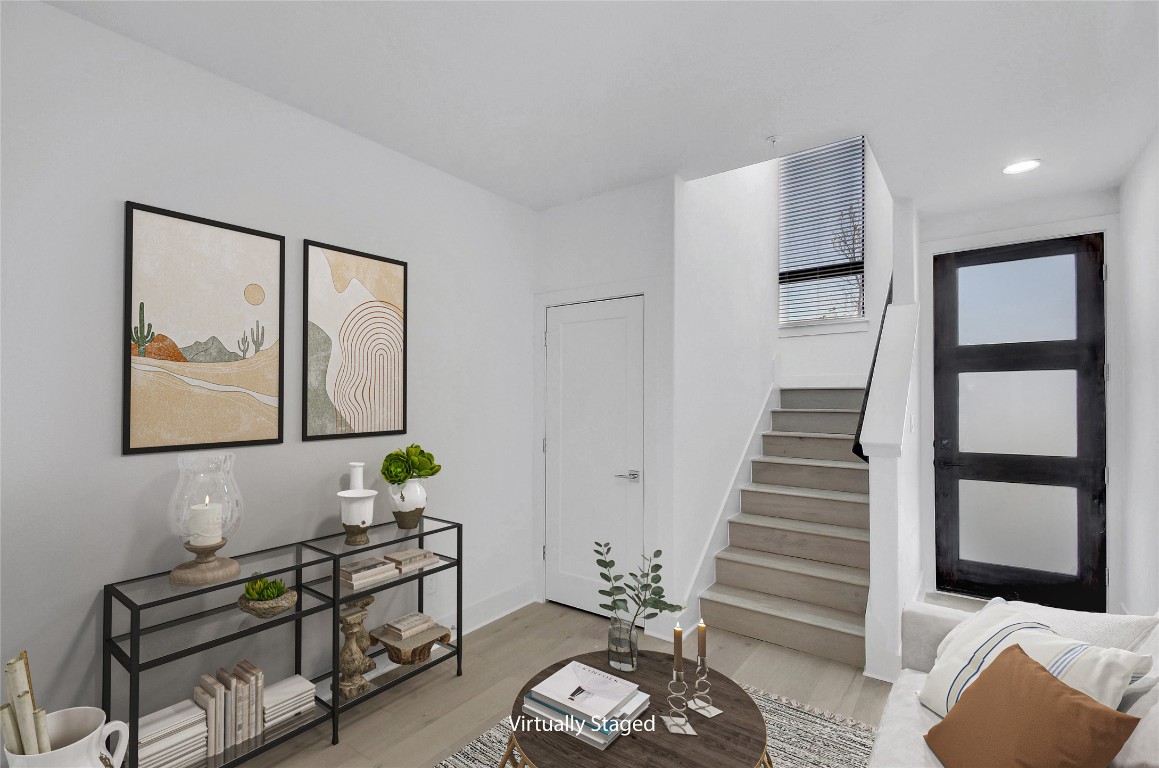 2050 Lohmans Spur Road, Unit 402 Austin, TX 78734 - Photo 2 of 39 a living room with furniture and wooden floor