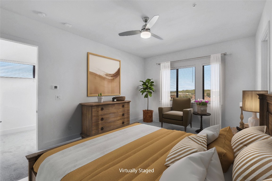 2050 Lohmans Spur Road, Unit 402 Austin, TX 78734 - Photo 21 of 39 a bedroom with a large bed and a window