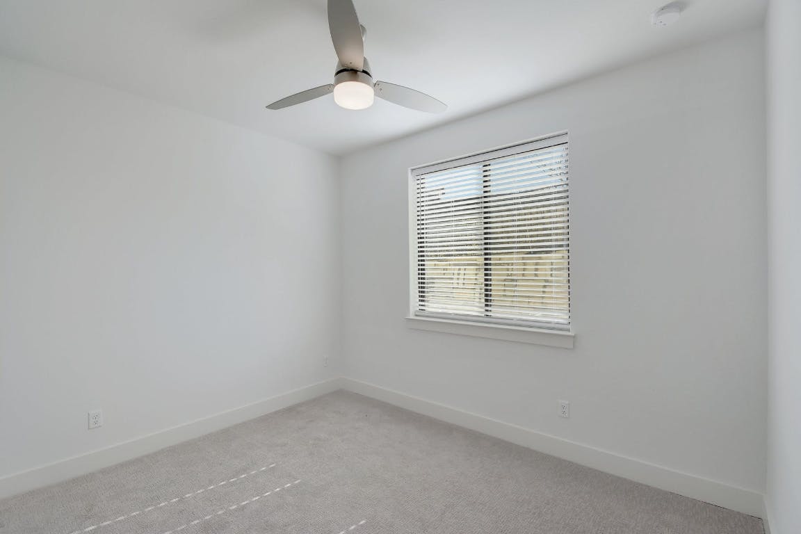2050 Lohmans Spur Road, Unit 402 Austin, TX 78734 - Photo 25 of 39 an empty room with a window