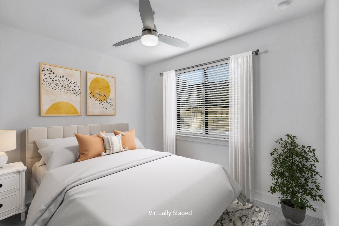 2050 Lohmans Spur Road, Unit 402 Austin, TX 78734 - Photo 26 of 39 a bedroom with bed and a window
