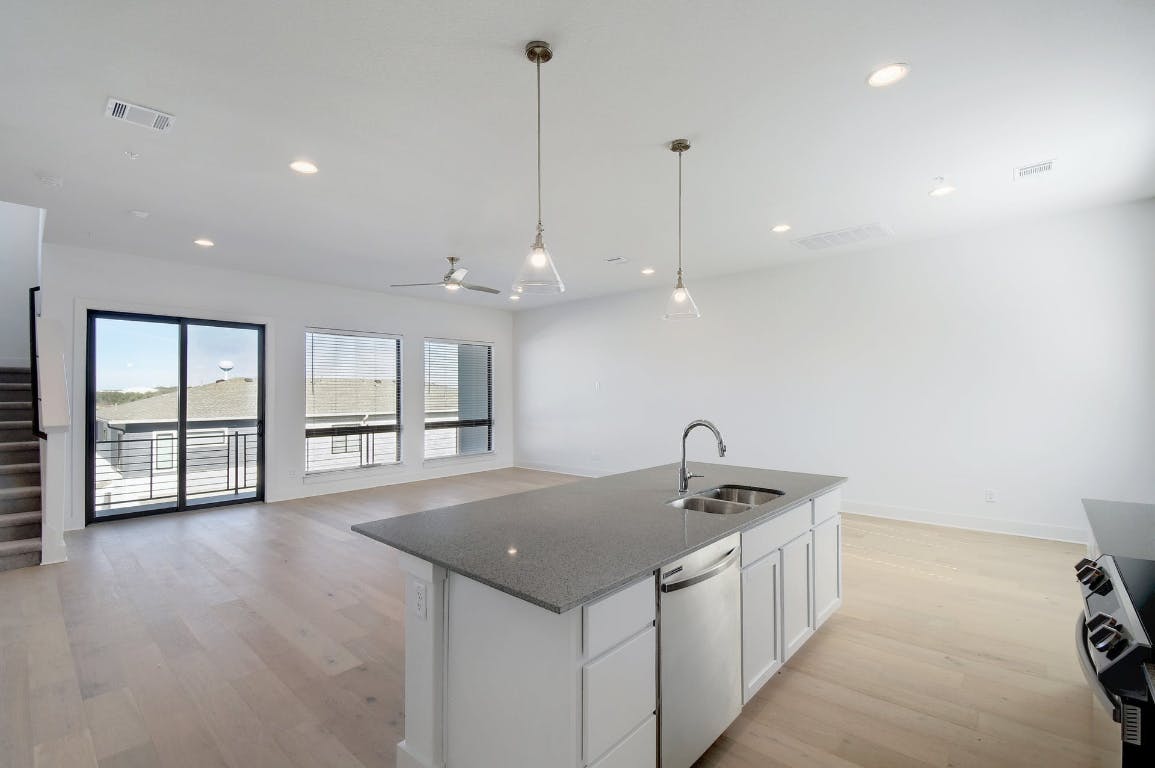2050 Lohmans Spur Road, Unit 402 Austin, TX 78734 - Photo 6 of 39 a kitchen with a sink and window