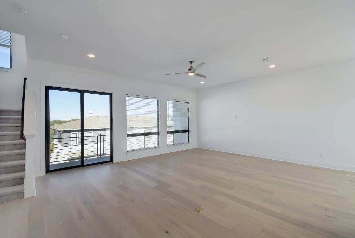 2050 Lohmans Spur Road, Unit 402 Austin, TX 78734 - Photo 7 of 39 a view of an empty room with a window