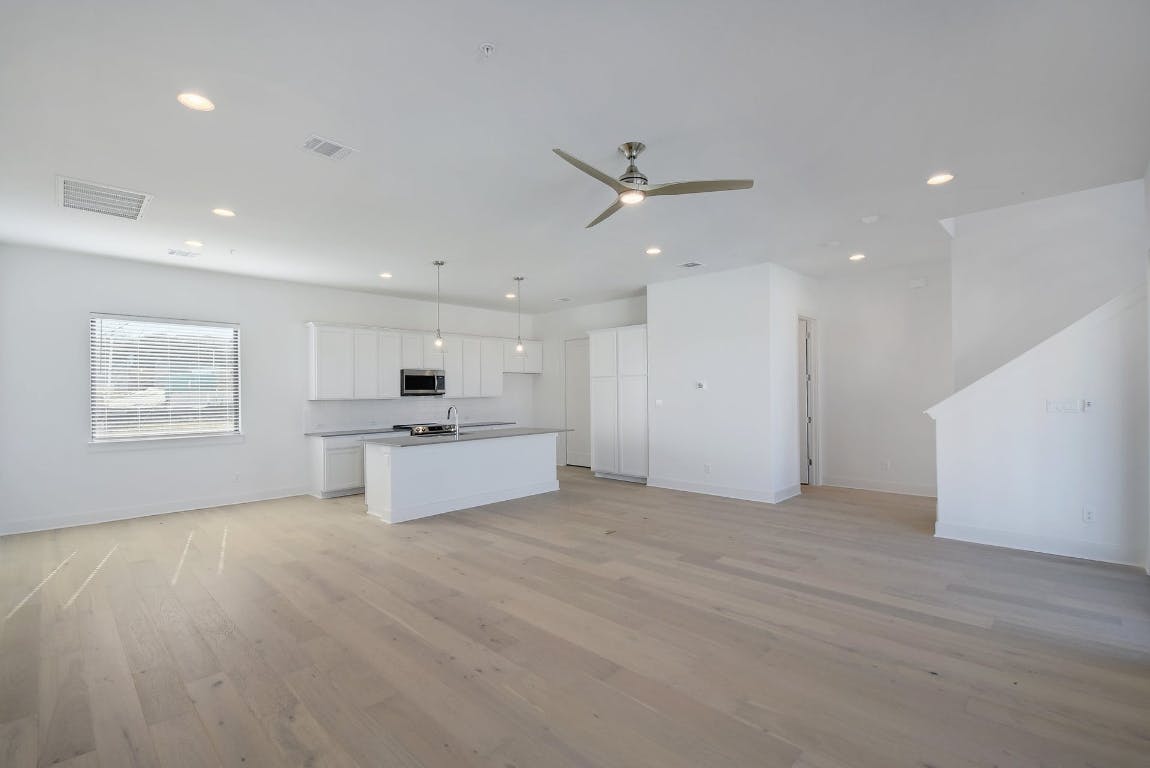 2050 Lohmans Spur Road, Unit 402 Austin, TX 78734 - Photo 9 of 39 a view of kitchen with a sink stainless steel appliances and window