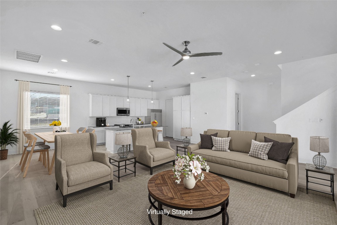 2050 Lohmans Spur Road, Unit 402 Austin, TX 78734 - Photo 10 of 39 a living room with furniture kitchen and a table