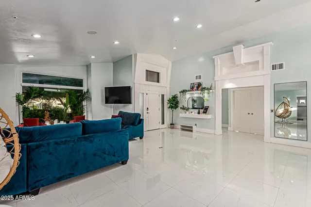 a kitchen with a sink a stove and chairs