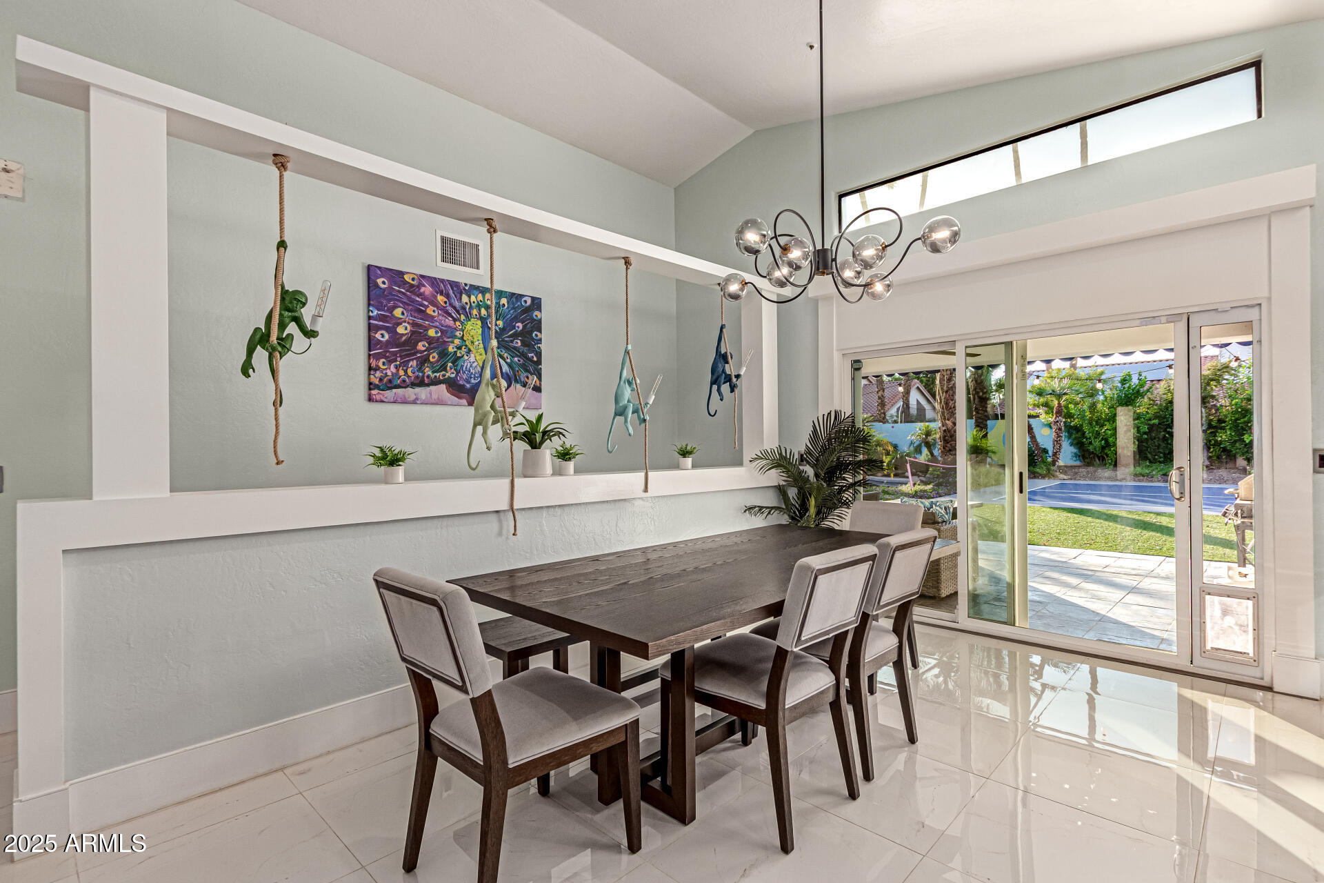 12528 North 78th Street Scottsdale, AZ 85260 - Photo 13 of 62 a view of a dining room with furniture a chandelier and a large window