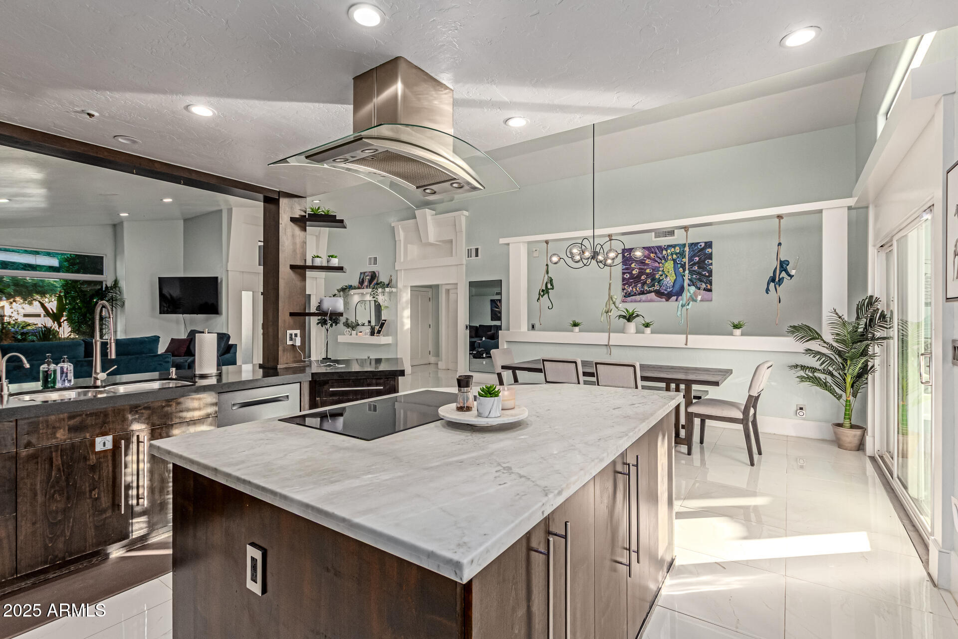 12528 North 78th Street Scottsdale, AZ 85260 - Photo 16 of 62 a kitchen with granite countertop a table chairs and white cabinets