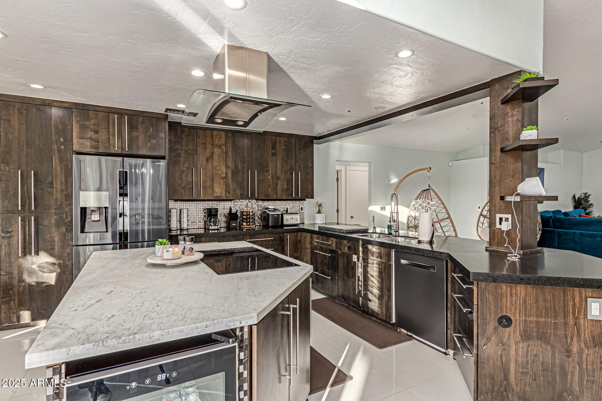 12528 North 78th Street Scottsdale, AZ 85260 - Photo 17 of 62 a kitchen with kitchen island a sink stove and cabinets