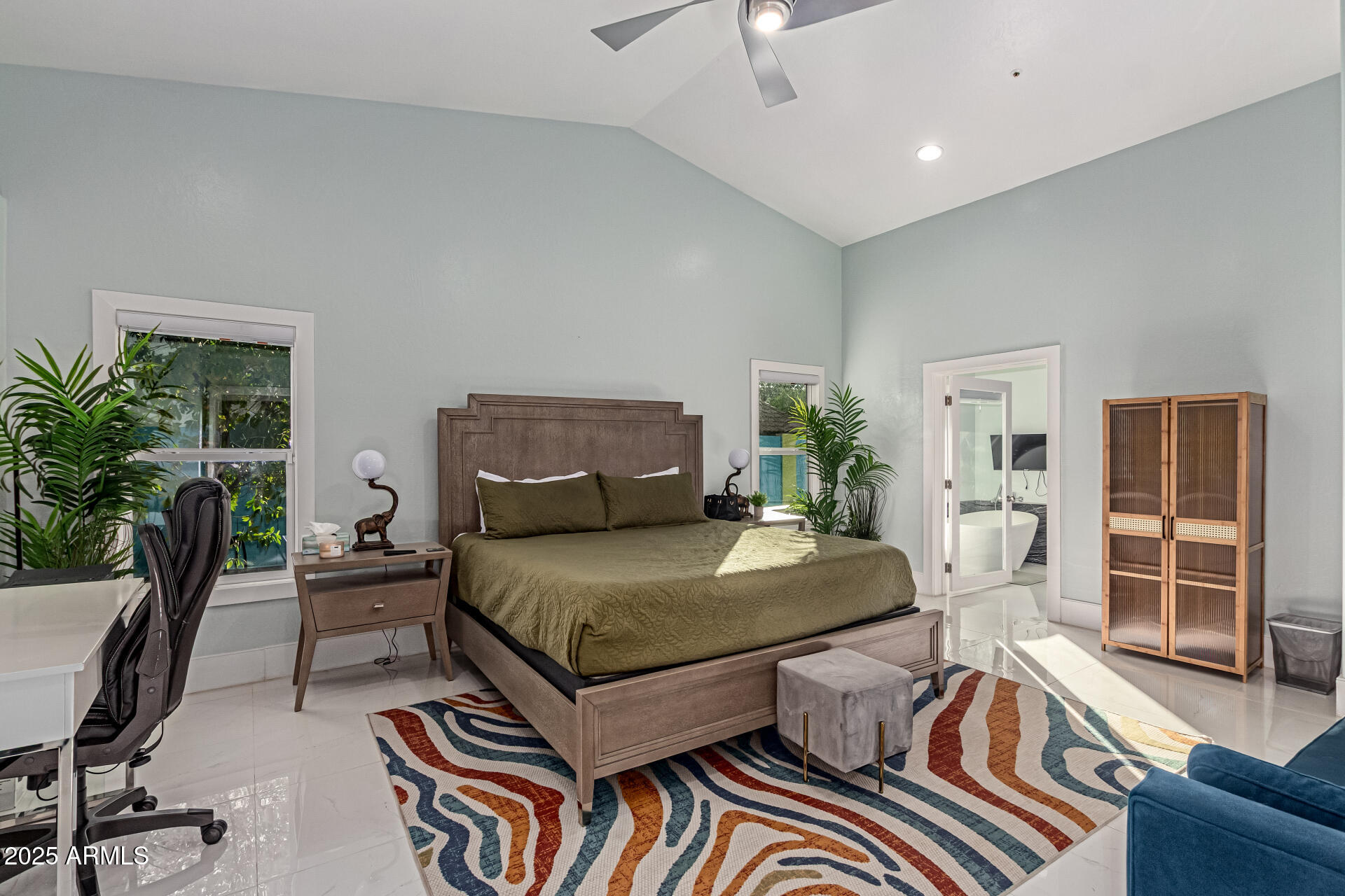 12528 North 78th Street Scottsdale, AZ 85260 - Photo 19 of 62 a bedroom with furniture and a potted plant