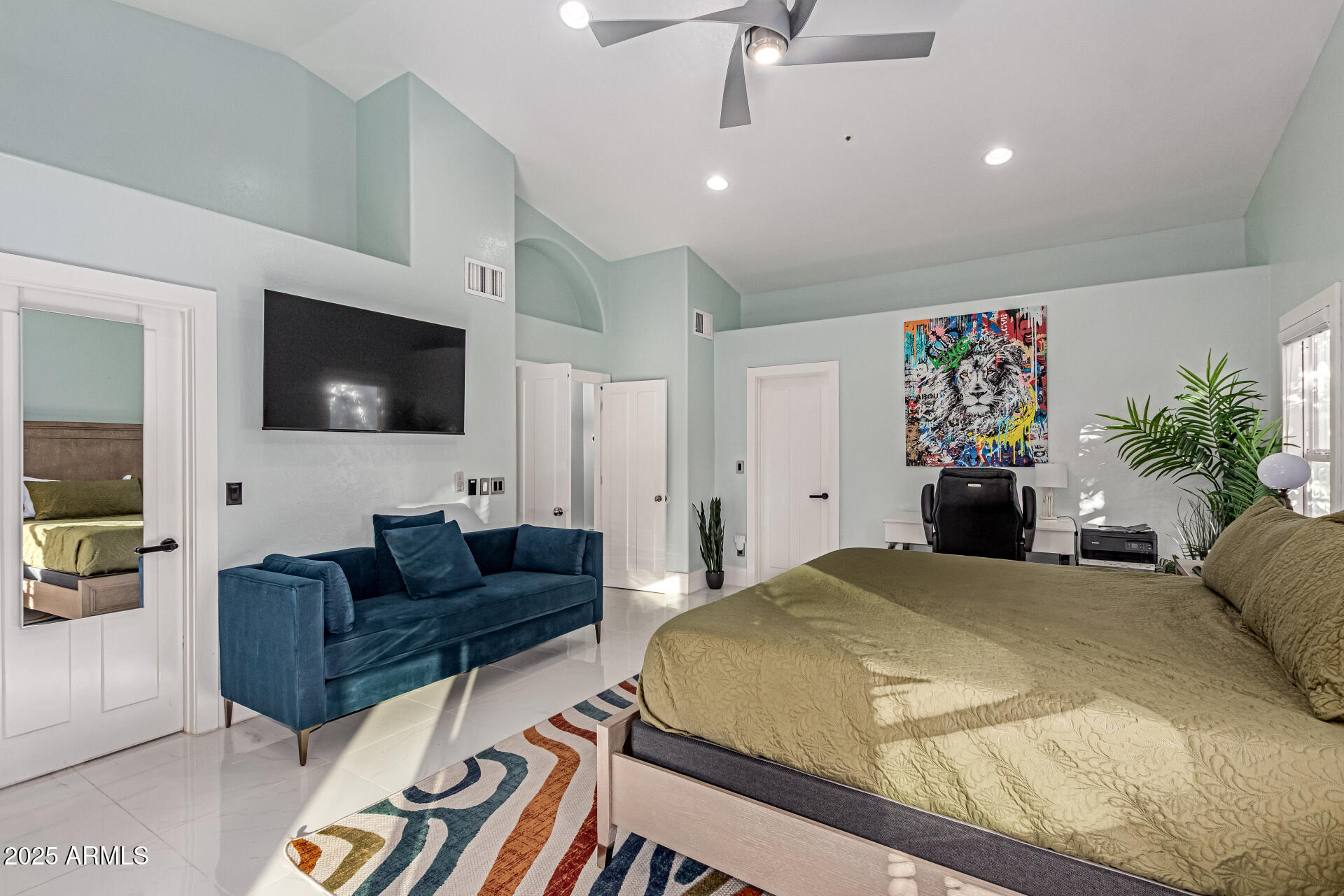 12528 North 78th Street Scottsdale, AZ 85260 - Photo 20 of 62 a bedroom with a bed a couch and a flat screen tv