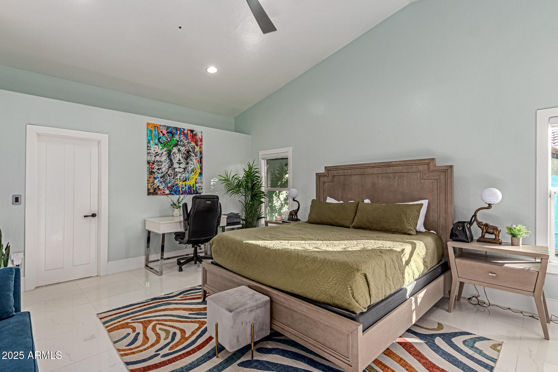 12528 North 78th Street Scottsdale, AZ 85260 - Photo 21 of 62 a bedroom with a bed and a table in it