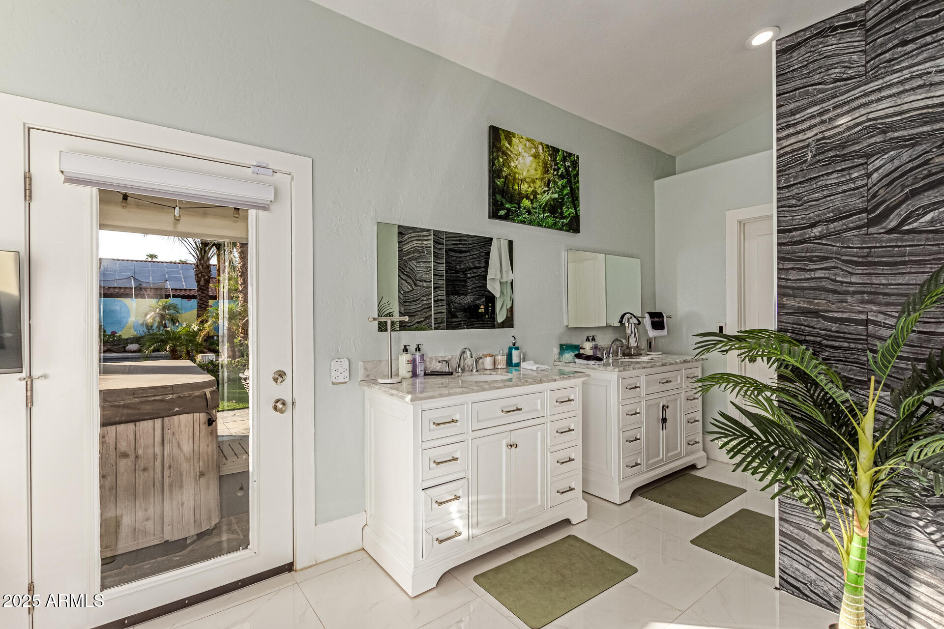 12528 North 78th Street Scottsdale, AZ 85260 - Photo 22 of 62 a spacious bathroom with a granite countertop sink a mirror and a potted plant