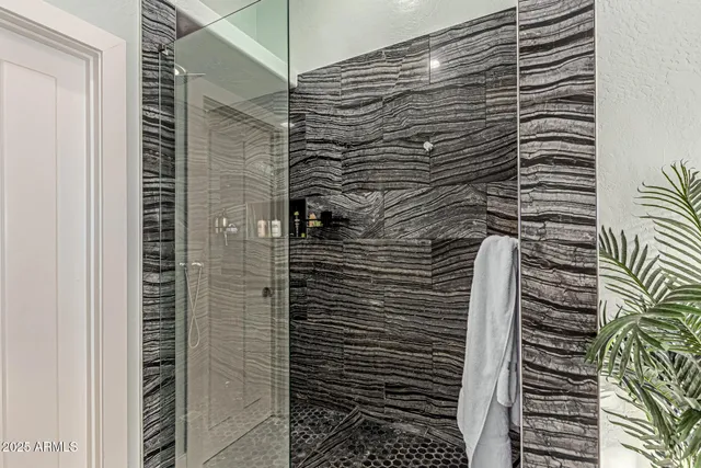 a bathroom with a shower and a bathtub