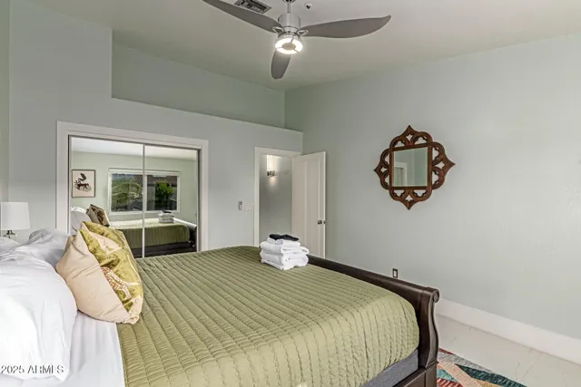 a living room with furniture and a clock