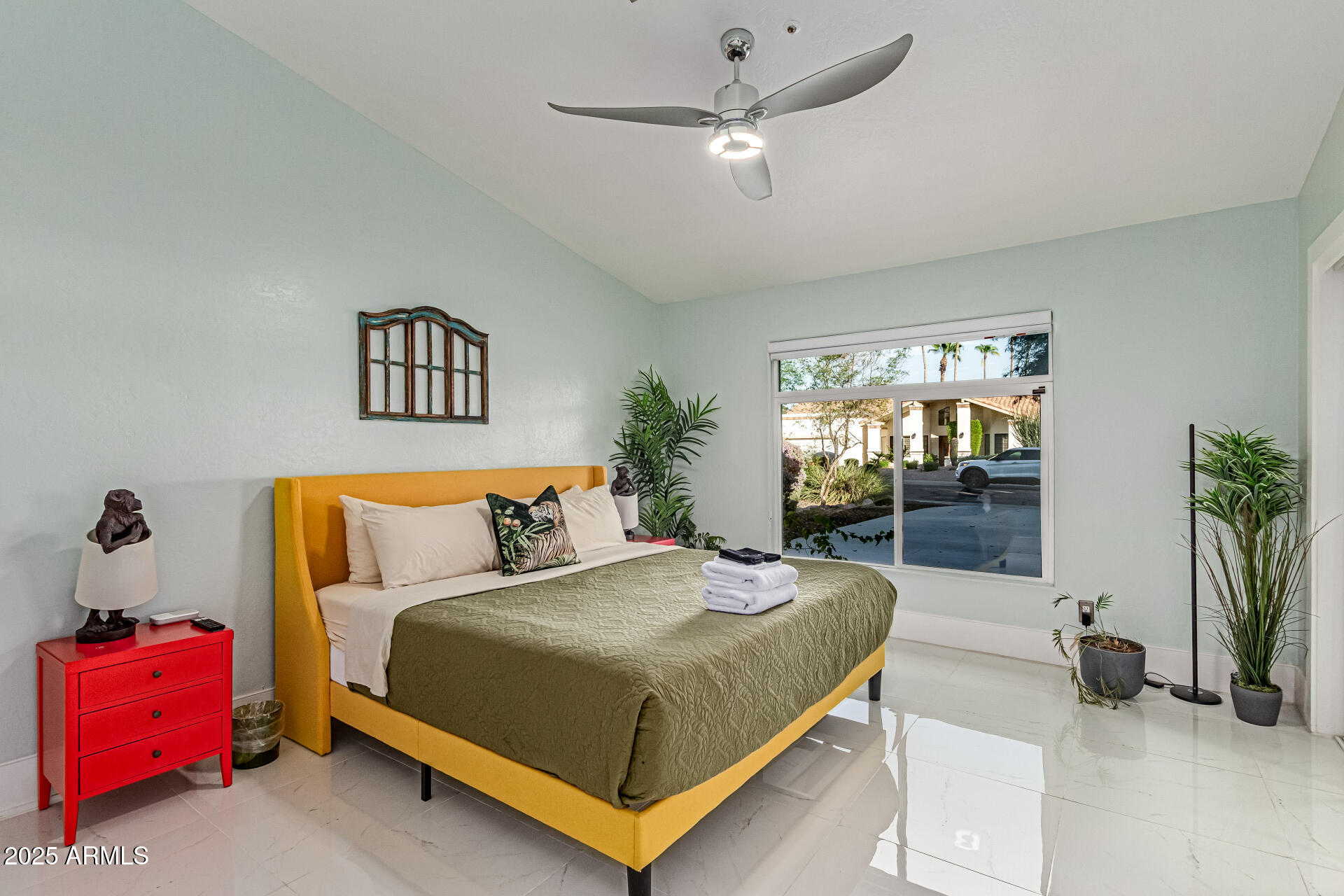 12528 North 78th Street Scottsdale, AZ 85260 - Photo 30 of 62 a bedroom with a bed and a couch