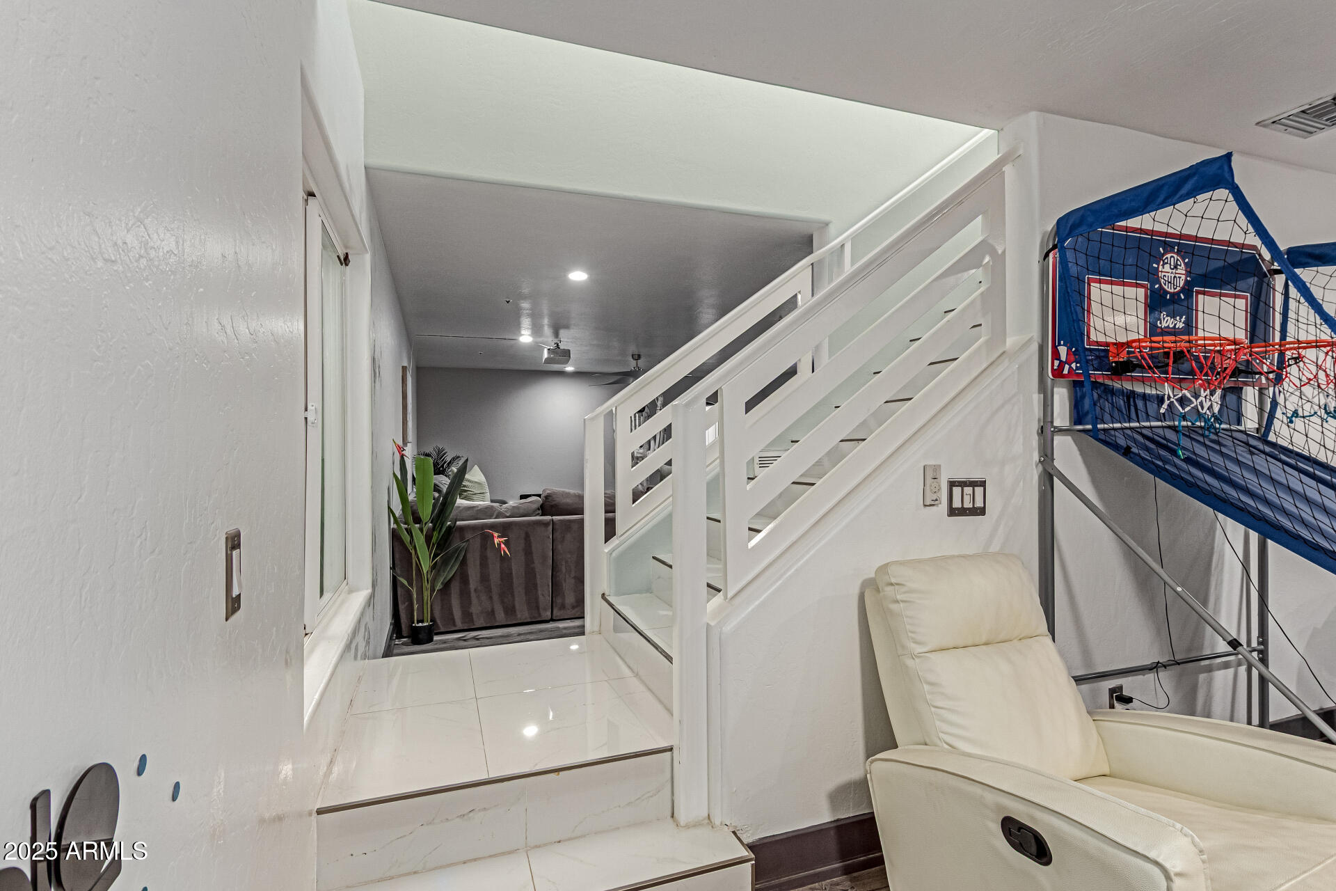 12528 North 78th Street Scottsdale, AZ 85260 - Photo 32 of 62 a living room with furniture and a clock