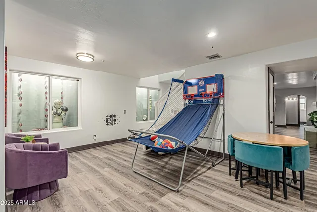 a kitchen with stainless steel appliances granite countertop a sink a stove and cabinets