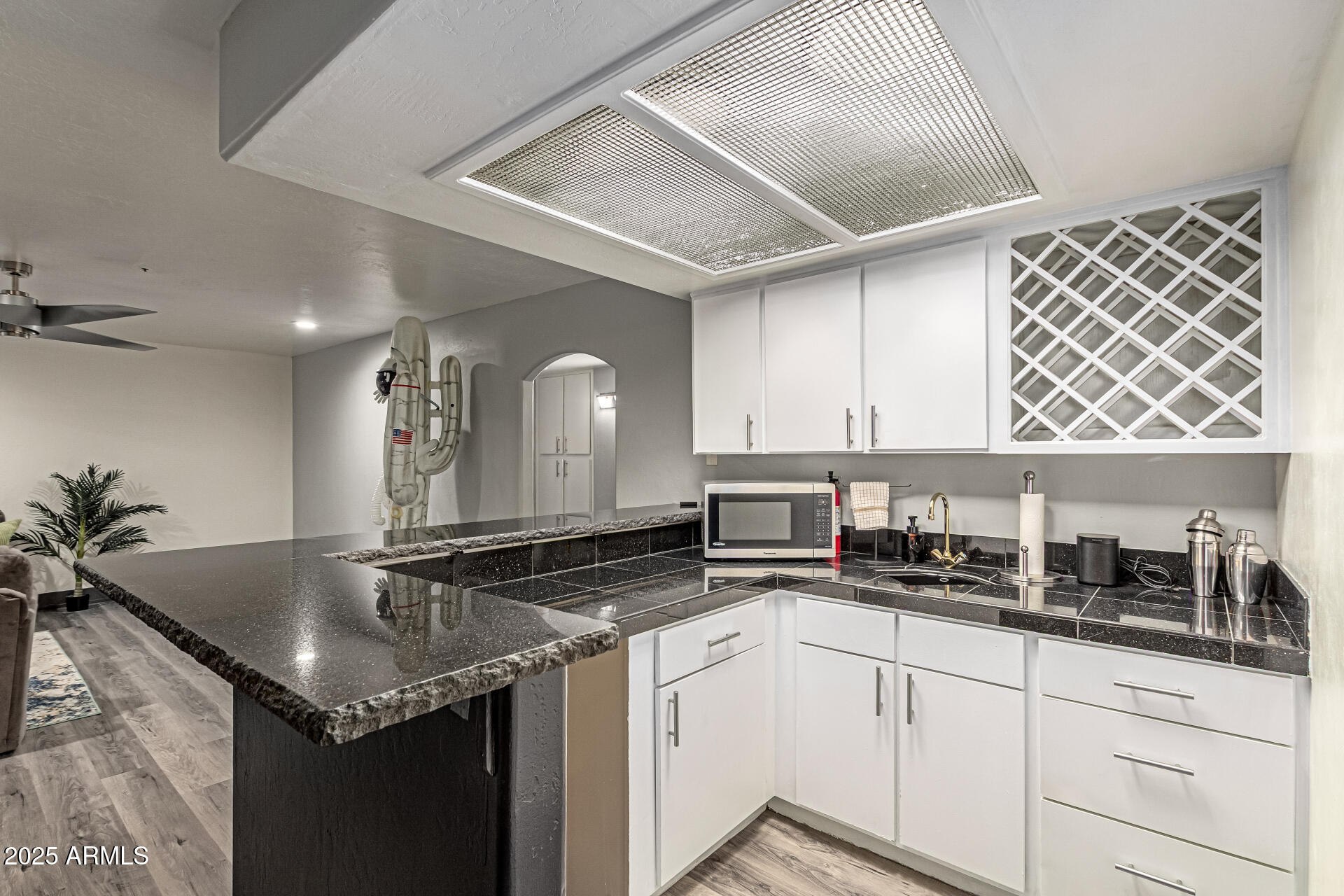 12528 North 78th Street Scottsdale, AZ 85260 - Photo 41 of 62 a kitchen with stainless steel appliances granite countertop a sink a stove and cabinets